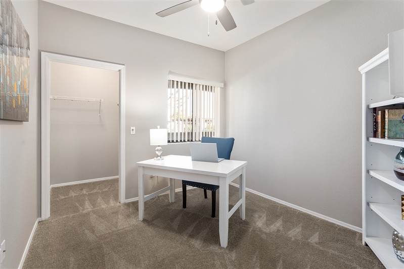 Work or study area shown — representative home at The Cove Apartments.