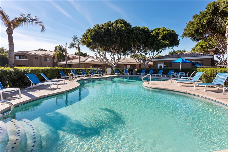 Pool and poolside area at The Cove Apartments.