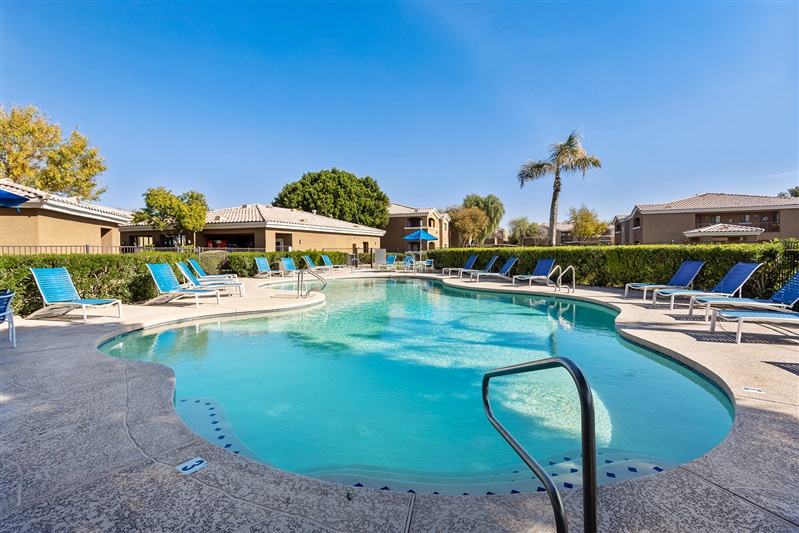 Pool and poolside area at The Cove Apartments.