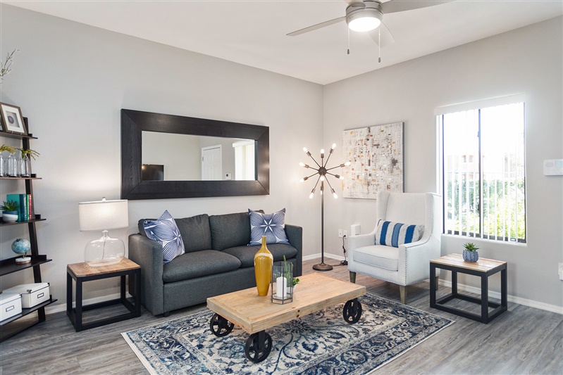Furnished apartment living area shown — representative home at The Cove Apartments.