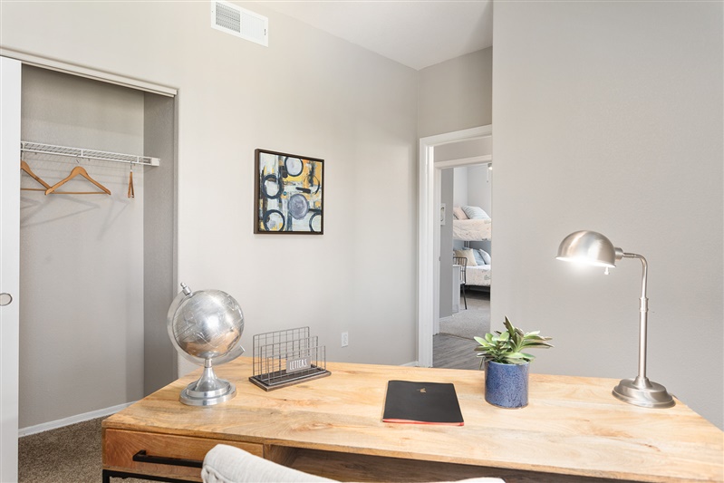 Work or study area shown — representative home at The Cove Apartments.