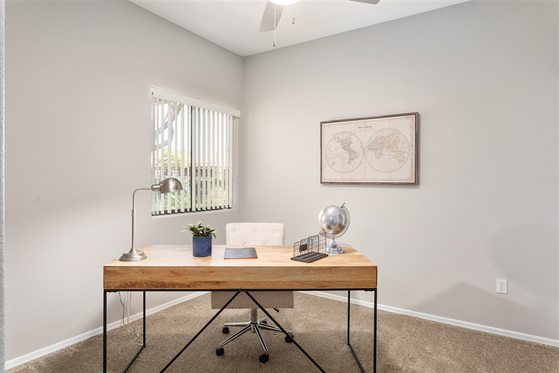 Work or study area shown — representative home at The Cove Apartments.
