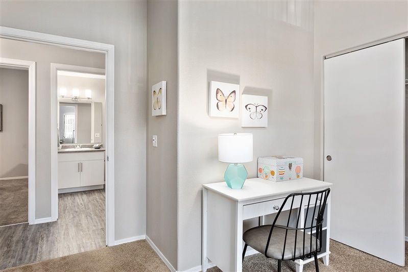 Work or study area shown — representative home at The Cove Apartments.